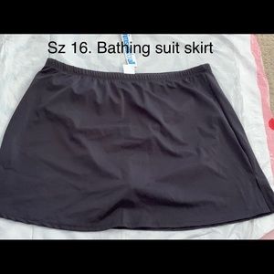 Black bathing suit skirt. Side slits